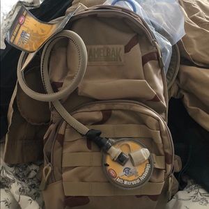 Camelback maximum gear backpack w/ cleaning kit.